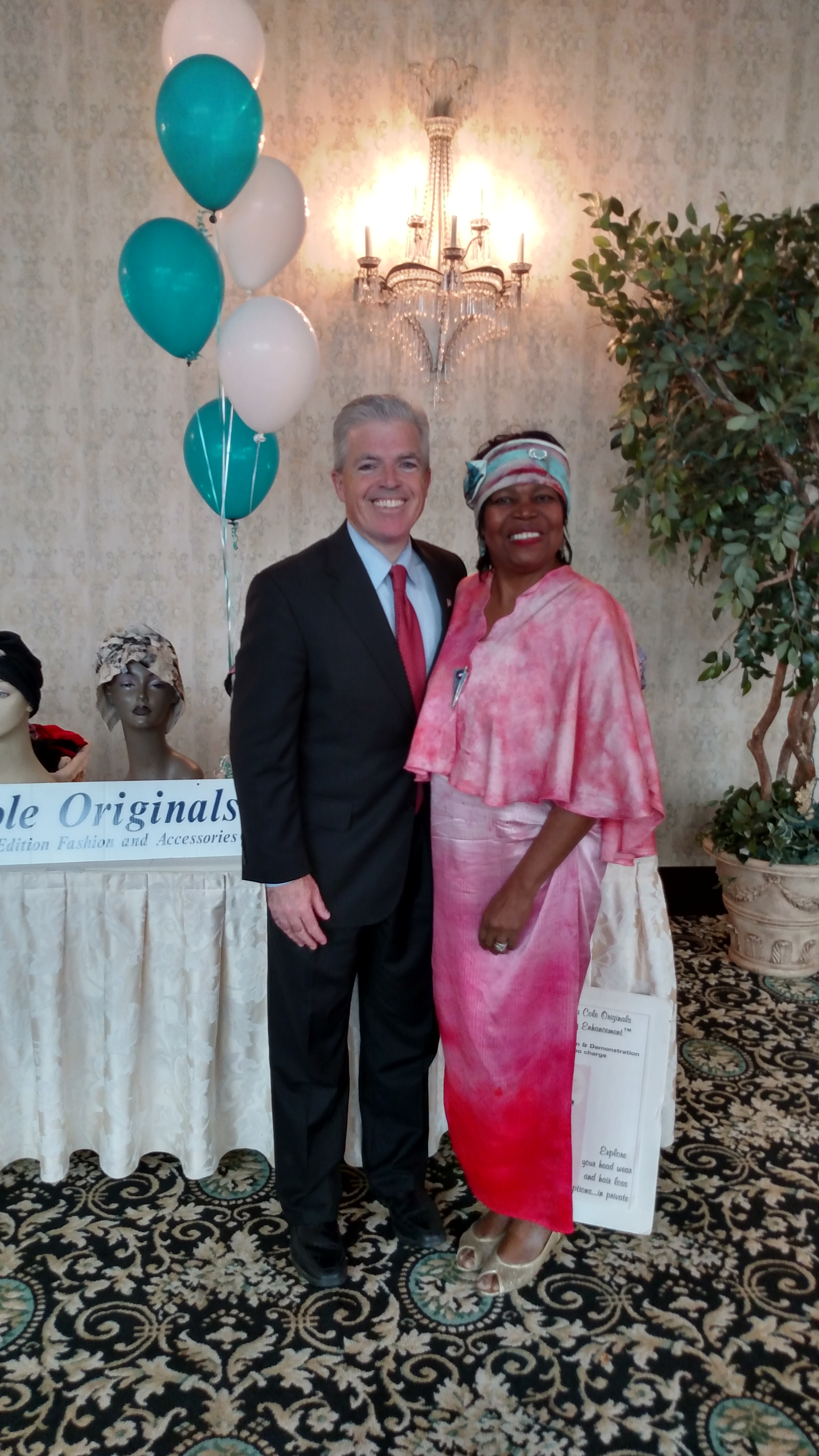 Suffolk County Executive Steve Bellone Stops by Madona Cole Originals Dignity Headwear Display Table at East Wind Inn 